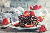 Waffle dessert with chocolate sauce and strawberry