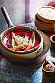 Steamed king prawns with glass noddles and white soy (China)