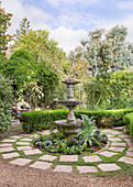 Fountain in circular flower bed