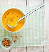 Cream of pumpkin soup with roasted peanuts