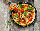 Vegan courgette and tomato pizza
