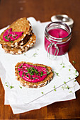 Wholemeal bread topped with a beetroot spread and cress