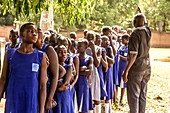 Schoolgirls queuing for vaccination
