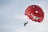 Tourists parasailing