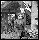 Girl by bombed building in London during World War II