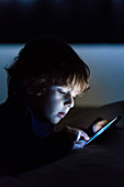 4 year old boy playing with a smartphone