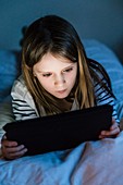 10 year-old girl using a digital tablet