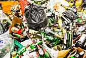 Glass recycling in a bottle bank, Paris, France