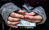 Woman rolling cigarette