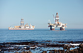 Oil rig and drillship at sea