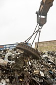 Electromagnet in scrap metal yard