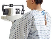 Overweight woman using hospital weighing scales