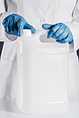 Chemist opening white plastic canister