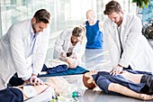 Doctors undertaking CPR training