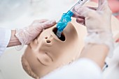 Doctor practising intubation on a dummy