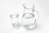 Glass and jug with drinking water