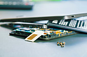 Disassembled mobile phone in the service centre with interna
