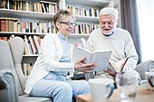 Senior couple reading books