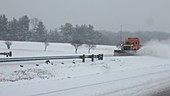 Snow plow on highway