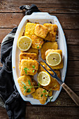 Vegan corn cutlets (made with polenta and sweetcorn) with lemon