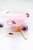 Grapefruit and violet flower ice lollies