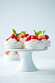 Pavlova with whipped cream and berries