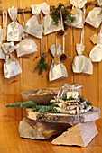 Advent calendar made from sandwich bags above rustic candle lantern