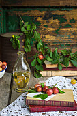 Fresh mirabelle plums in rustic enviroment with bottle of rakija (fruit brandy)