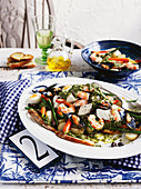 Genovese seafood vegetable salad with salsa verde (Italy)