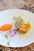 Carrot mousse with herb butter, red onions and crisps
