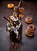 Chocolate Freak Shake topped with cream and mini doughnuts