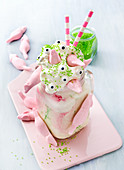 Pink Freak Shake topped with cream, sugar pearls and marshmallow mice