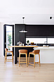 Bar stools at the breakfast bar in a modern kitchen