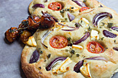 Focaccia with tomatoes, onions and cheese
