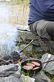 Roast reindeer steaks on a campfire (a traditional dish from Lapland)