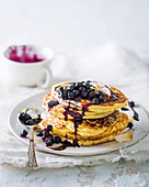Coconut-ricotta hot cakes with blueberry compote