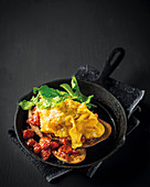 Sourdough bread with scambled eggs and tomatoes