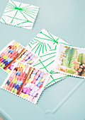 Memory card game made from holiday photos on green-and-white fabric backing