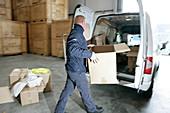Loading boxes into removals van