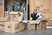 Packing boxes at removals and storage facility