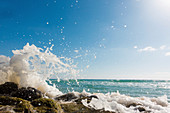 Waves breaking against rocks