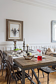Rustic dining table and metal chairs in dining area
