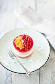Cream cheese and redcurrant tartlet with a pink sponge finger base