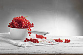 Redcurrants in a saucepan and next to it