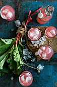 Rhubarb juice with ice cubes in glasses