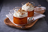 Pumpkin dessert with honey, cream and chopped nuts