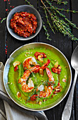 Cream of pea soup with scampi, garlic, chilli paste and thyme