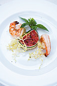 Tomato terrine with king prawns, zucchini, frisee salad and basil