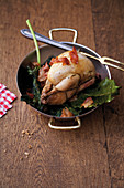 Oven-roasted quail with dried figs, fig leaves and lardo