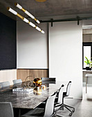 Table with marble top and chairs in the meeting room with sliding door